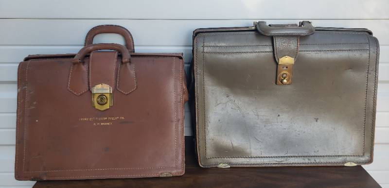 lot 34 image: 2 Vintage Leather AttacheBrief Cases - 1 Olive Green, 1 Tan that is stamped Panhandle Eastern Pipeline Co - Largest is 18in W x 13in T