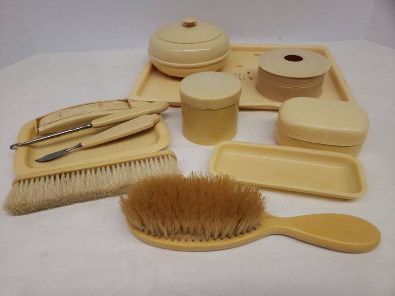 lot 131 image: Vintage Ivory Lady Jane Celluloid Dresser Set & Beauty Accessories - Large Monogram Tray, Hair Brush,  Hair Receiver, Powder Box, Soap Saver, Small Trays, Nail Buffer, Cuticle Tool, Button Hook, Shoe Brush, & Dresser Jars