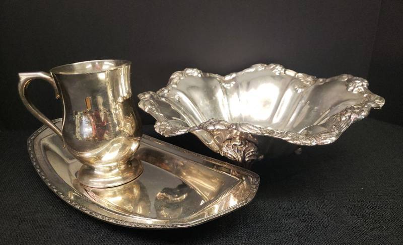 lot 133 image: Vintage Silver Plate Serving Pieces Eaton Triple Footed & Fluted Console Bowl with Applied Floral Boarder and Original Foil Sticker - 10.5in W, Stamped Homanplate on Nickel Silver Serving Tray #4103 by W. M. Mounts - 12.75in L, and Monogramed Tankard Mug