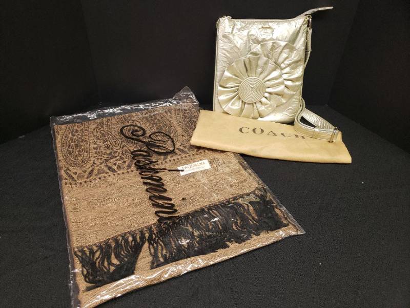 lot 141 image: Vintage COACH Leatherwear Stamped - Metallic Silver Swingpack Crossbody Bag with Rosettes - includes Dust Cover Bag - 8.25in W x 10in T not inlcuding Strap, and NIP Pashmina Shawl Scarf in Camel & Black Paisley Design with Black Fringe