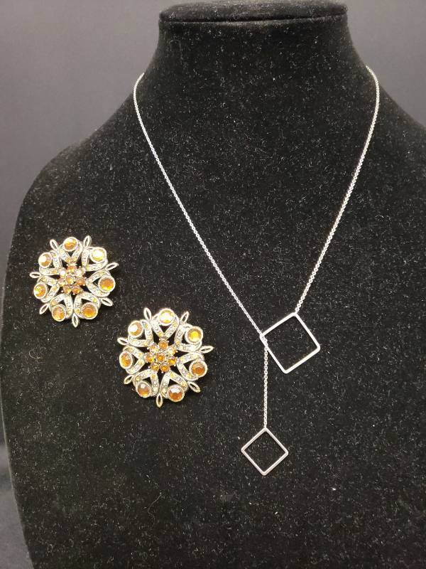 lot 143 image: Pair of Metal Victorian Style Lapel Pins with Honey Amber Rhinestones - 1.75in W, and Silver Tone Fine Link Chain Necklace with Interlocking Squares - 22in L
