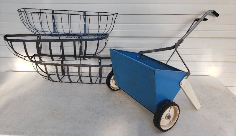 lot 76 image: Vintage Blue Metal Lawn Spreader and 3 Vintage Metal Window Box Planter Baskets - 36in L x 7.5in T