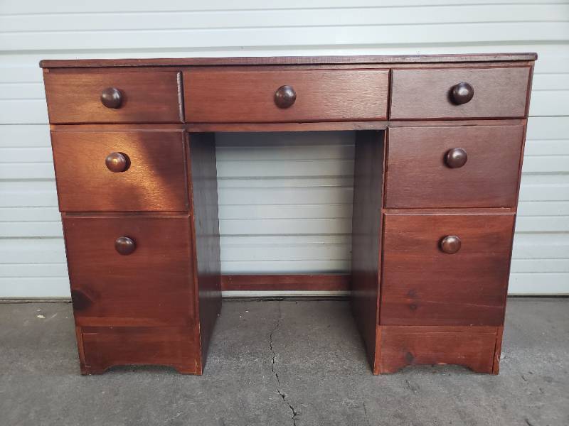 lot 90 image: Vintage Wood 7 Drawer Desk - 42in W x 16.5in D x 30in T