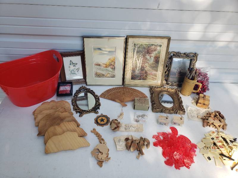 lot 93 image: Plastic ToteTub with CraftingDecor Supplies - Frames, Wood Cut-outs, Puzzles, Painting Supplies, Leather Strip Cutter, Art, Mirrors, & NOS Music Boxes