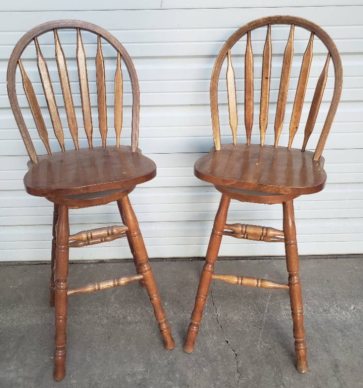 lot 157 image: Pair fo Solid Oak Swivel Bar Stools - Curve Top Slat Backs - with Base Foot Rails - Seat Height 30in T - Back Height 47in T