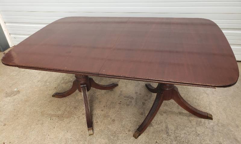 lot 1 image: Vintage 1950s Double Pedestal Duncan Phyfe Dining Table with Hide-A-Way Center Leaf & Brass Cap Feet - Legs will be Detached for Pickup - Full Open  62in L x 40in W x 30in T - 74in L at Longest with Leaf in