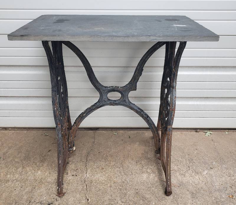 lot 25 image: Table made from Antique Singer Manufacturing Company Iron Sewing Machine Base & Removable Granite Piece Top - 29in W x 15.5in D x 29in T