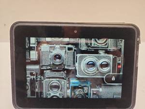 lot 5 image: Tablet Kindle with Folio Case Front Camera Micro-USB Port