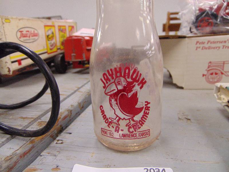 lot 2034 image: Vintage Jayhawk Creamery Milk Bottle