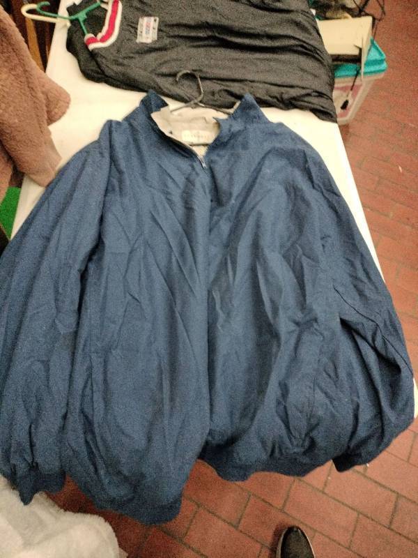 lot 63431 image: Consensus Golf windbreaker is a navy blue - XXLT