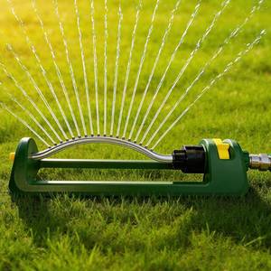 lot 47060 image: Lawn Sprinkler, 18 Brass Nozzles Garden Water Oscillating Sprinkler for Yard Covers up to 3,600 sq.ft, Heavy Weight Base, Built-in Spray Jet Cleaning Needle, Green, Yellow - Retail $19