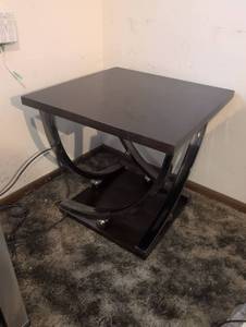 lot 107 image: Black End Table with Curved Shelf and Metal Base
