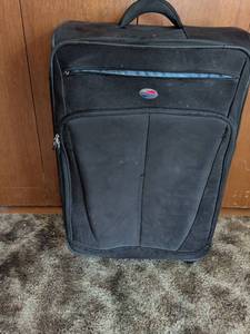 lot 180 image: Samsonite Black Upright Rolling Luggage Suitcase