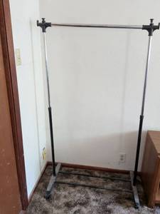 lot 200 image: Adjustable Clothing Rack with Double Rod and Casters