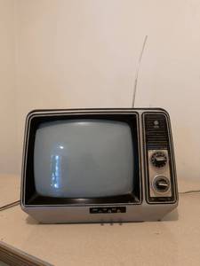 lot 478 image: General Electric Performance Television AC DC Portable CRT TV