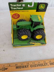 lot 714 image: John Deere Monster Treads Tractor Lights and Sounds Toy ERTL