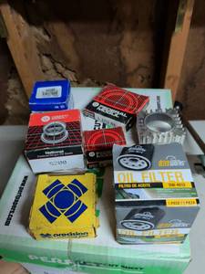 lot 807 image: Lot of 7 Automotive Parts Oil Seals, Oil Filter, Thermostat