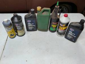 lot 822 image: Automotive Fluids Lot 8 Bottles Brake Steering Jack Oil