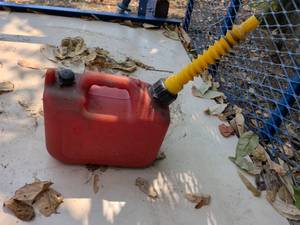 lot 938 image: Red Fuel Transfer Tank with Yellow Hose and Nozzle