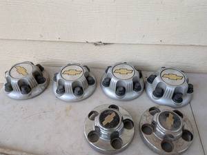 lot 1003 image: Chevrolet Wheel Center Caps with Gold Bowtie Logo, Set of 6