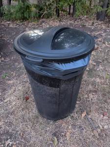 lot 1033 image: Black Plastic Outdoor Trash Can with Swing Lid and Side Handles