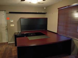 lot 909 image: Large Black and Brown Office Desk.  L Shaped with 2 Filing Cabinets.  See pictures for details and dimensions.   Bring help to remove this item