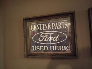 lot 911 image: Framed Genuine Parts FORD Used Here.     17 x 21