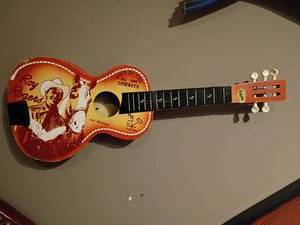 lot 920 image: Roy Rogers Small Guitar    Missing the strings.  Approximately 29in long