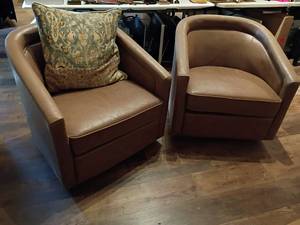 lot 926 image: 2 Tan Leather Suede Swivel, Barrel Chairs.  Height 30in.  Seat 22 x 25