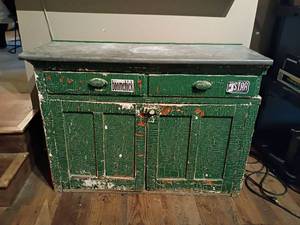 lot 930 image: Vintage Wooden Cabinet with Metal Top.  Bottom Storage.  31 x 43 x 16
