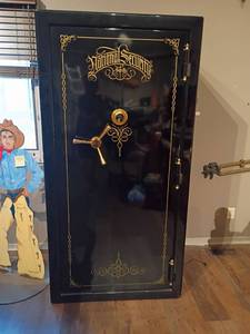 Safe by National Security Safe Co. Black and Gold Colored.  72 x 36 x 30. You will need to bring help to remove this item!