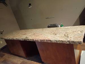 lot 935 image: Granite top cabinets 30 x 101 x 24 in VERY HEAVY 800 POUNDS will need help and proper equipment to remove.