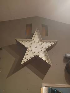 lot 938 image: Large voice activated light up star (simply say echo turn on star) Approximately 4ft. Will need to bring ladder to remove from wall