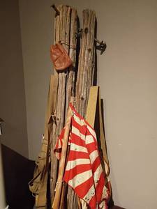 lot 947 image: Old Light Poles with bags and a flag