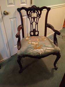 lot 989 image: Chippendale Style Carved Mahogany Armchair.  Featuring Asian Motif.   Seat needs reupholstered.  Seat 21 x 22.  Height 35in.