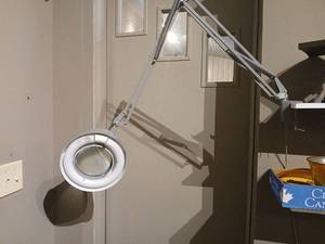 lot 1000 image: Magnifying Lamp Fluorescent Articulating Arm bring tools to remove c clamp  from shelf