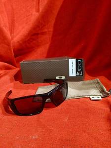 lot 1101 image: Oakley Fuel Cell Sunglasses Polished Black Frame Warm Grey Lens