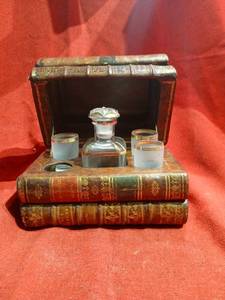 lot 1131 image: Antique faux book hidden decanter set missing one shot glass