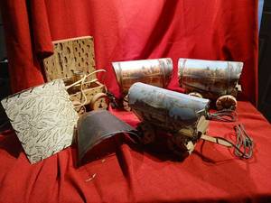 lot 1146 image: Scenic Landscape Lamps with Printed Forest and Mountain Scenes 3 , two work, one has broken wheels and 4 is disassembled