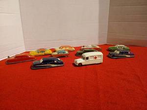 lot 1169 image: Vintage Argo Tin Litho toy Cars each with their own specialty  feature such as windshield wipers, windows, sirens, armored tank, all made in Japan