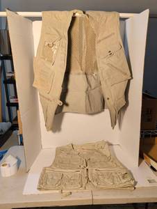 lot 1322 image: Two hunting or photo vests with multiple pockets