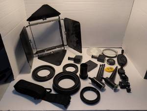 lot 1367 image: Camera gear assortment with barn doors lens hoods, filter cases and more