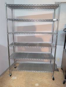lot 1442 image: 6-Tier Wire Shelving Unit with Casters 75x47x18 please come at the end of load out this shelf is in use.