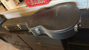 lot 1615 image: Guild guitar case with guitar stand