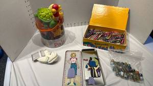 lot 1641 image: Magnetic dress-up doll tin, crayons, marbles and more