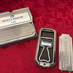 lot 1681 image: 2 Vintage Rolls Razors with lifetime blade