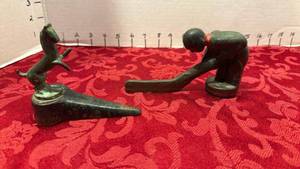 lot 1695 image: Cast iron door stop and hockey player largest 5x3.5