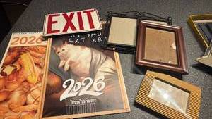 lot 1719 image: Picture frames, cat calendars and exit sign
