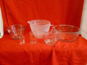 lot 1817 image: Measuring cups and bowls chip noted and discoloration  see picture