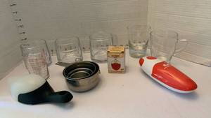 lot 1932 image: Sugar canisters, egg timer, can opener , measuring cups and more